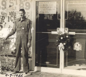 Man outside store Nov 1966